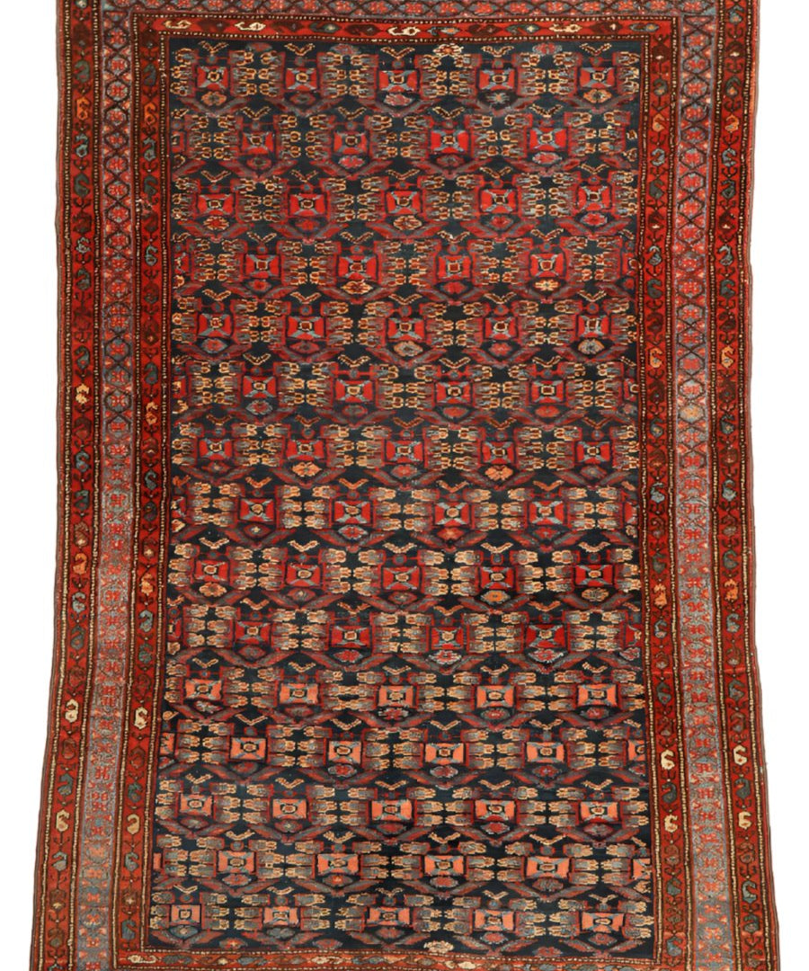Persian Hamadan rug with red border and blue geometric medallion pattern, fringed ends