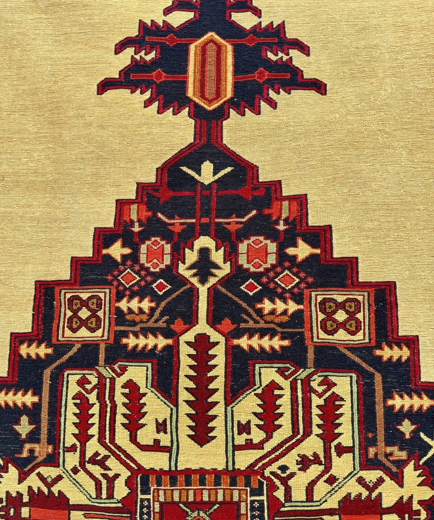 Persian Heriz soumak rug section, cream background with central star medallion in navy and red