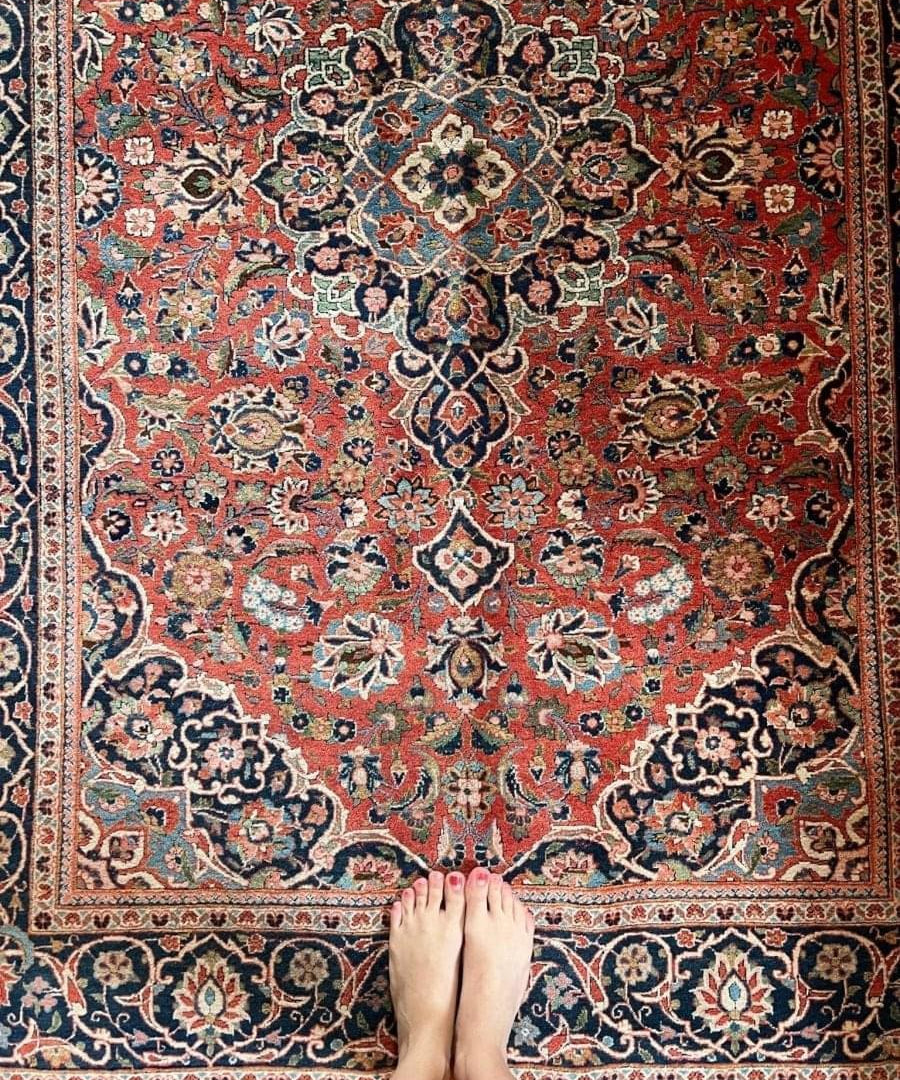 Persian Kashan rug with red field, navy and cream floral medallions