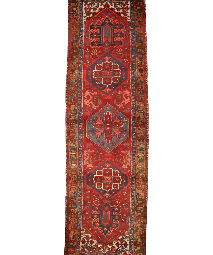 Red Persian-style mesh runner rug with central medallion and geometric border