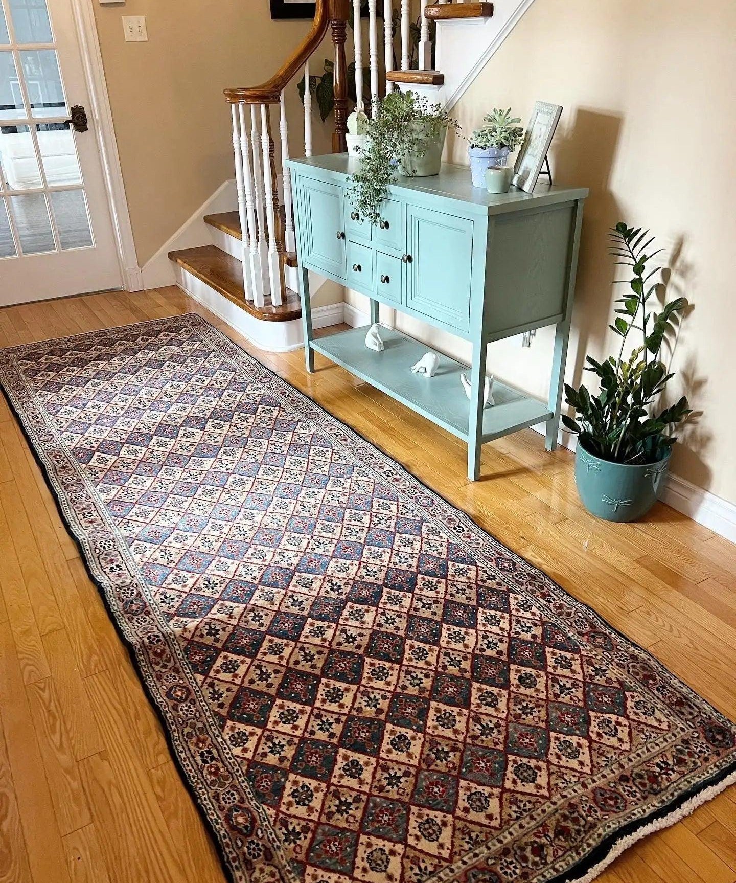 Persian-style runner rug with multicolor geometric diamond pattern and short fringe