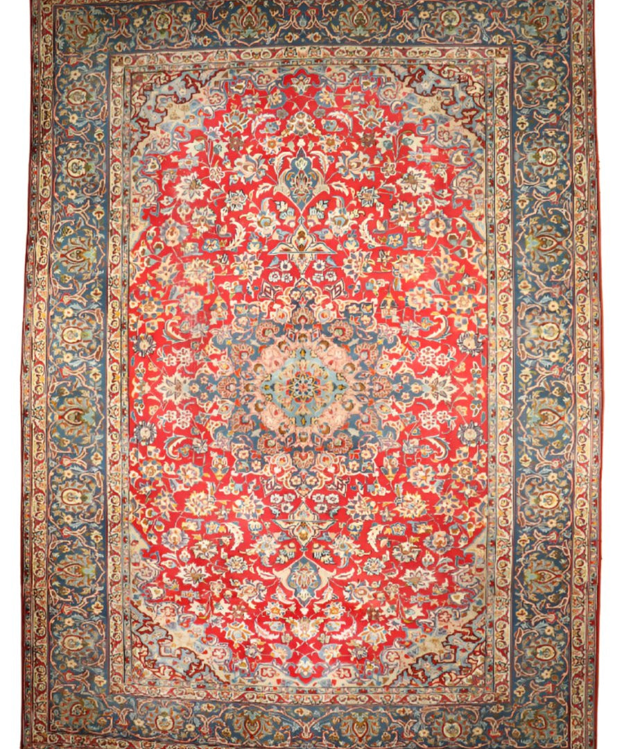 Persian-style area rug with red floral center and dark blue ornamental border