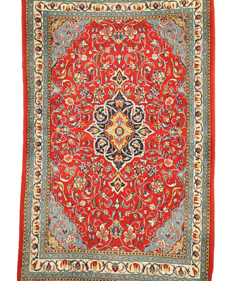 Persian Sarouk rug full view, red floral field with central diamond medallion, bordered
