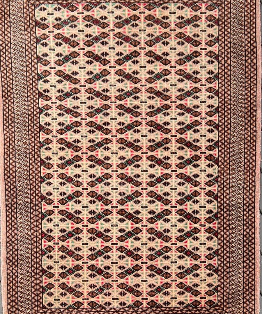 Persian Turkmen rug with geometric diamond lattice pattern, multicolor on dark red base