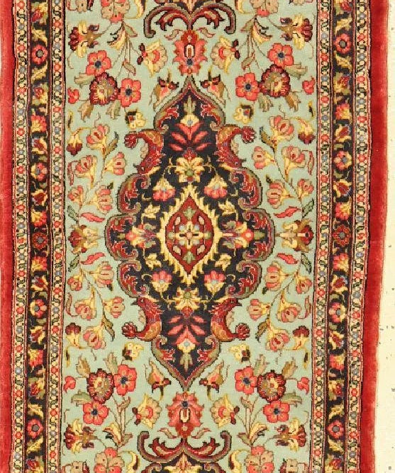 Persian Qom runner rug with ornate medallion and floral border, red and cream
