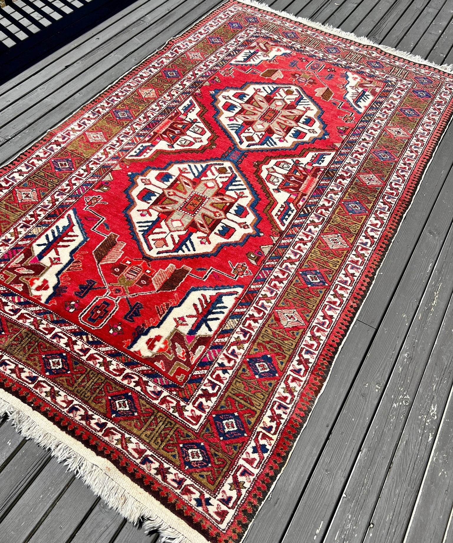 Vintage Persian Meshkin rug, red with cream and blue geometric motifs, corner medallions, fringe