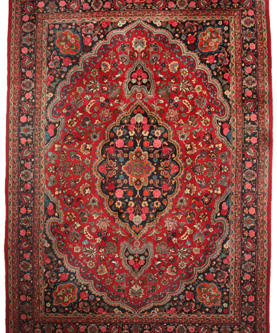 Persian Mashad rug red field with dark central medallion and floral ornaments