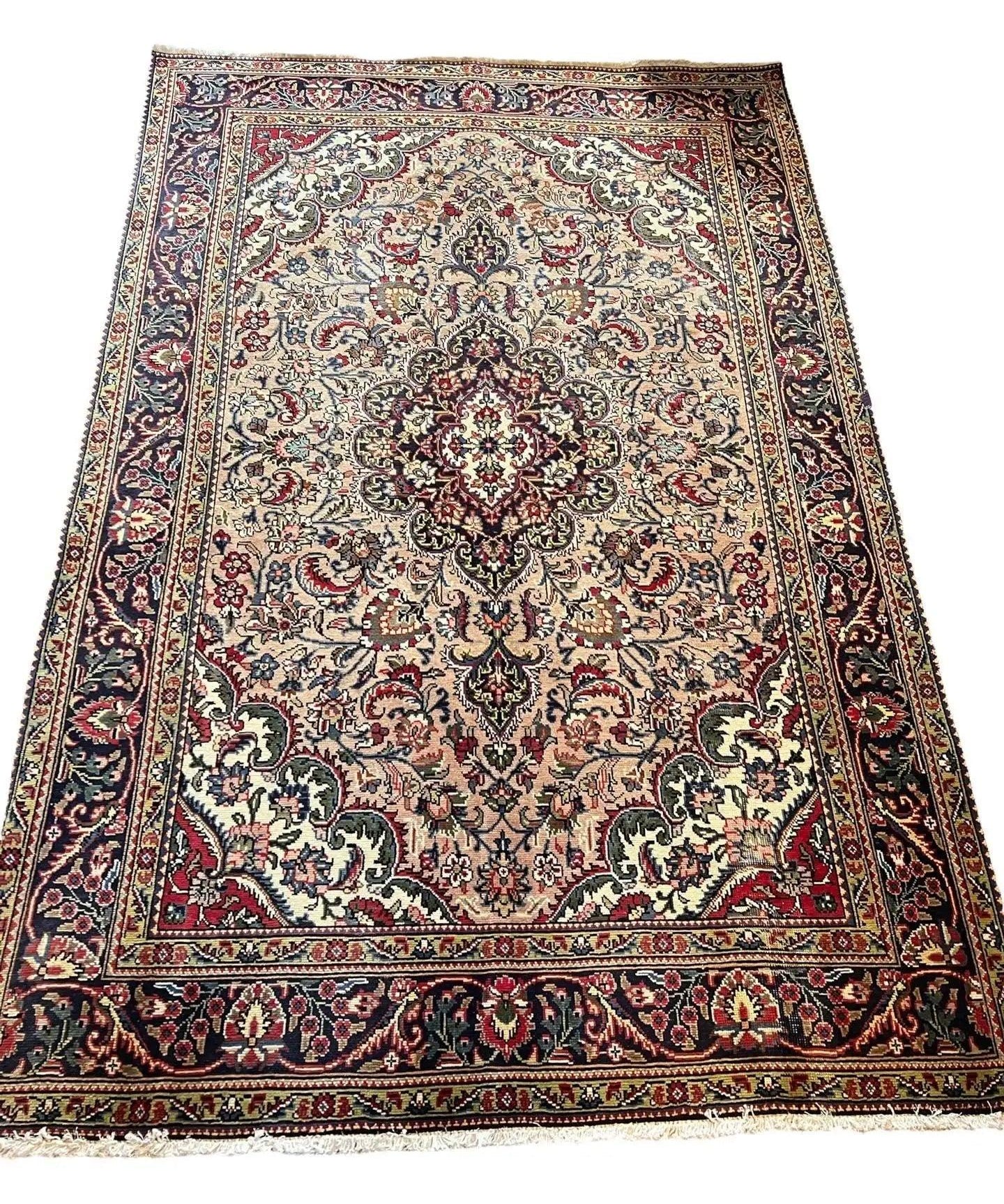 Persian Tabriz-style area rug, full border with ornate pattern, cream and dark navy red