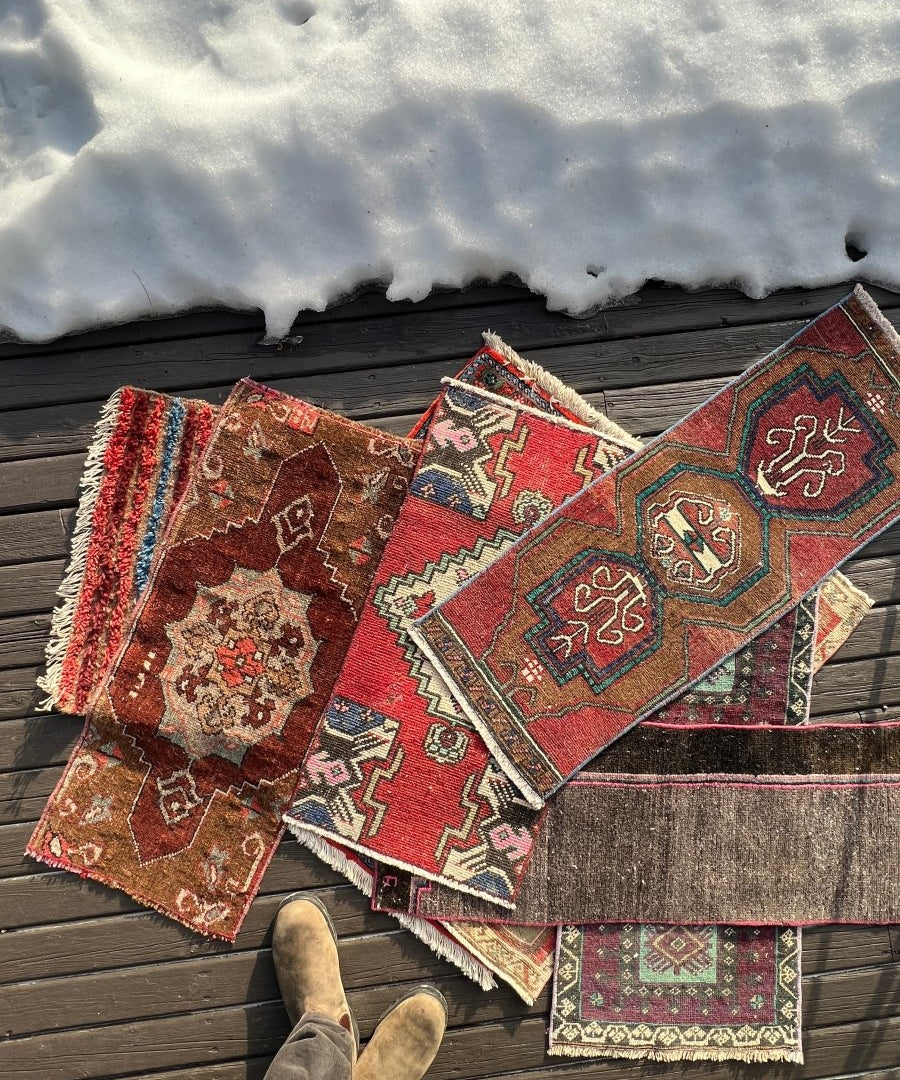 Turkish mini rugs, red geometric patchwork-style patterns with blue and beige accents, fringes