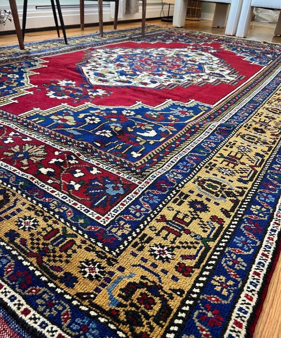 Turkish Taspinar area rug with red medallion, ornate blue corners, cream and gold border